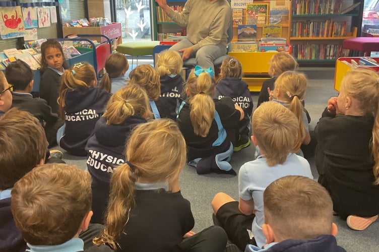 Dartmouth pupils listening to the story by author Erin Allgrove.